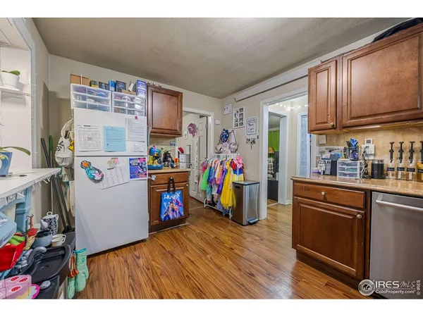 a kitchen with a refrigerator and a sink