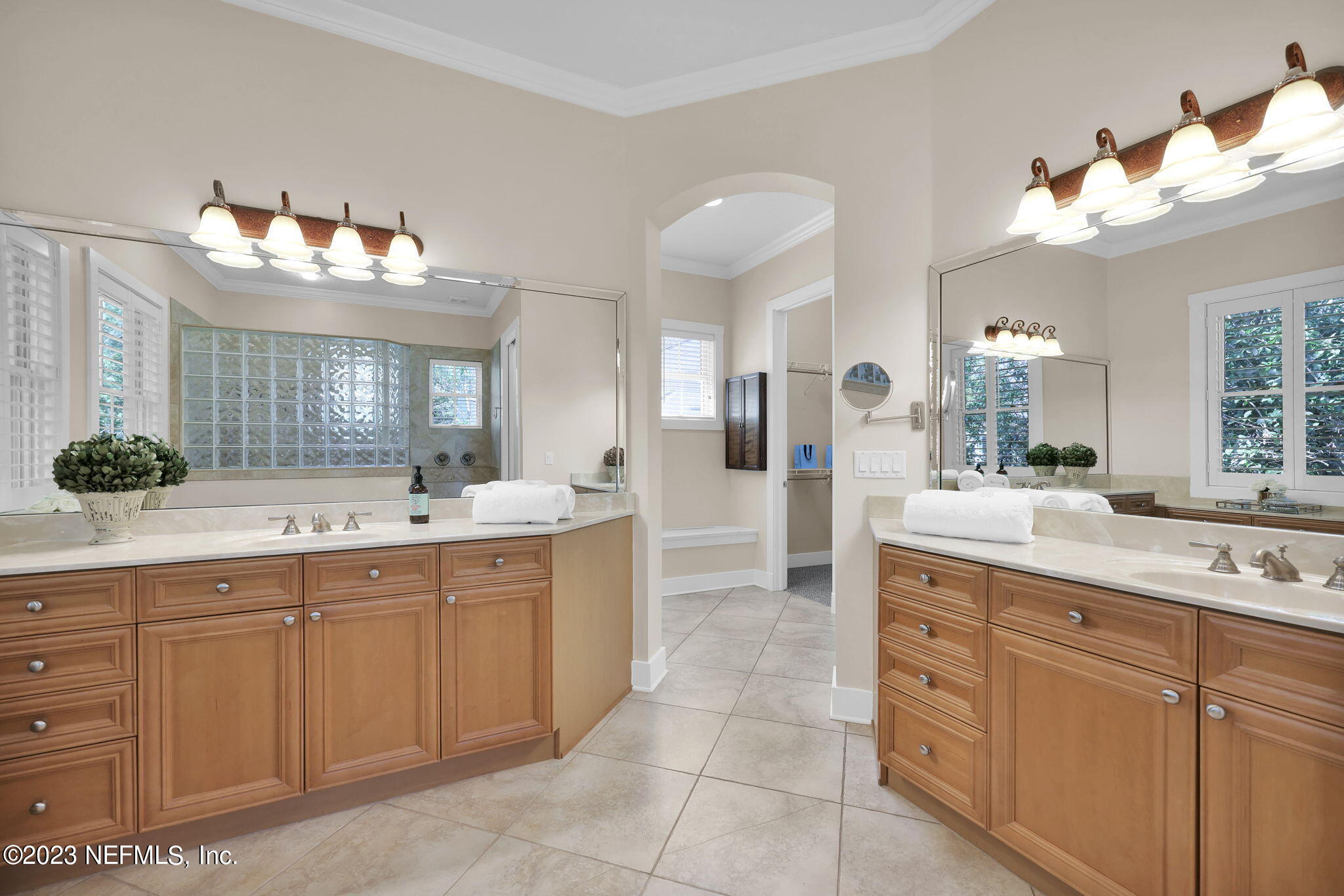 120 Istoria Drive St. Augustine, FL 32095 - Photo 38 of 90 a spacious bathroom with a double vanity sink and a mirror