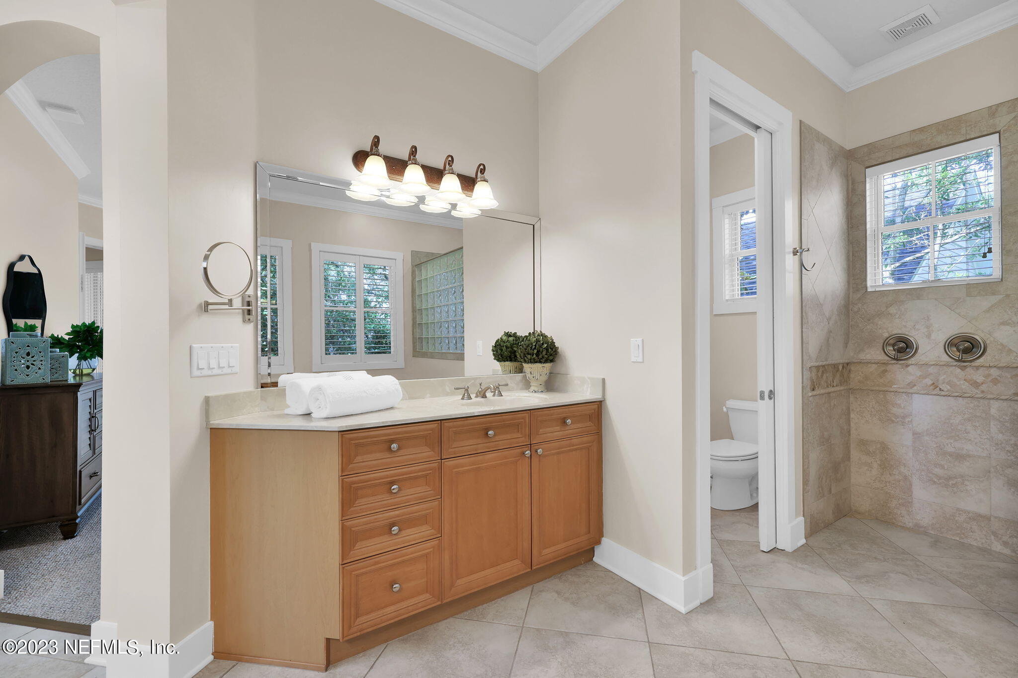 120 Istoria Drive St. Augustine, FL 32095 - Photo 41 of 90 a bathroom with a double vanity sink and a mirror