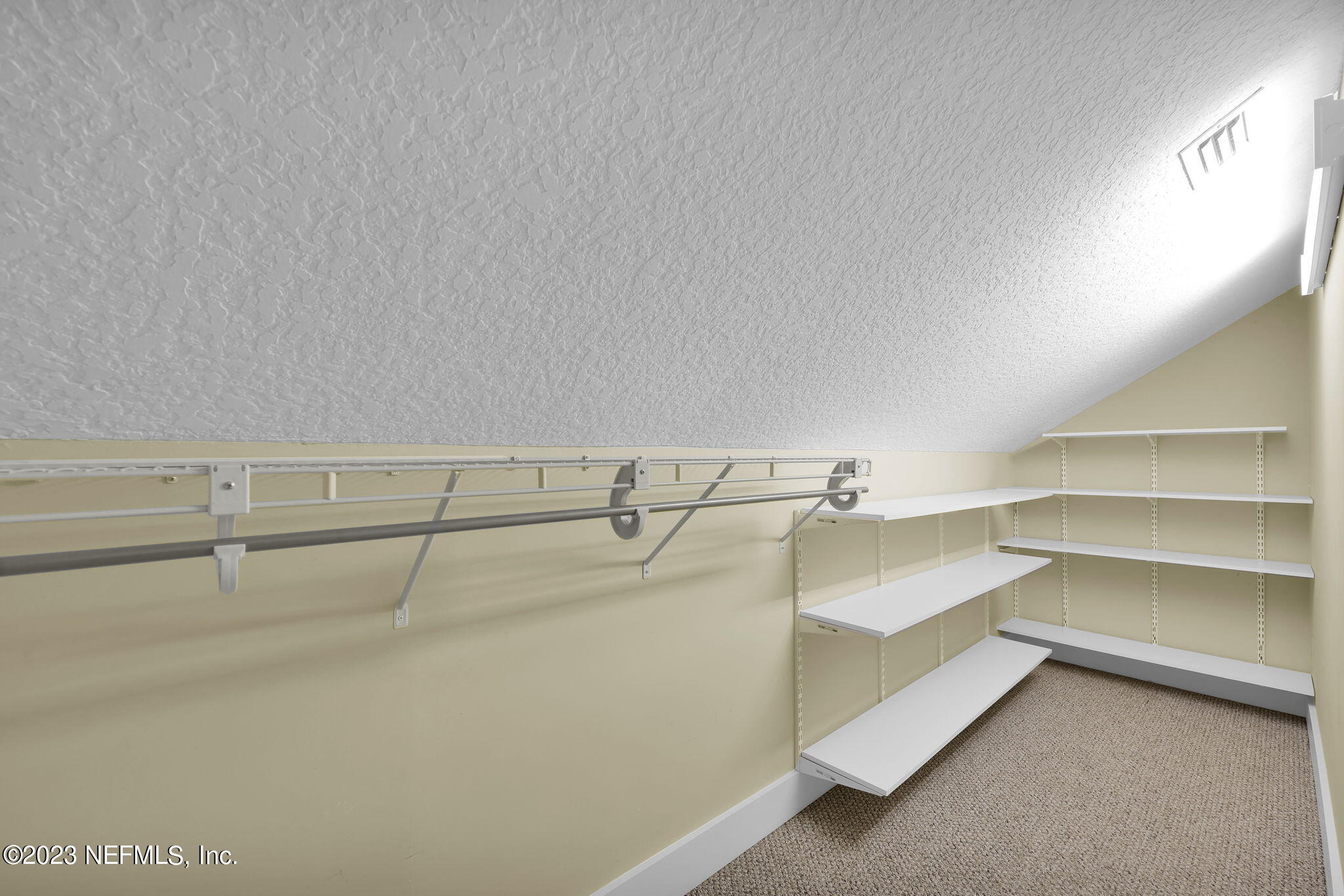 120 Istoria Drive St. Augustine, FL 32095 - Photo 48 of 90 a view of a room with racks on the wall