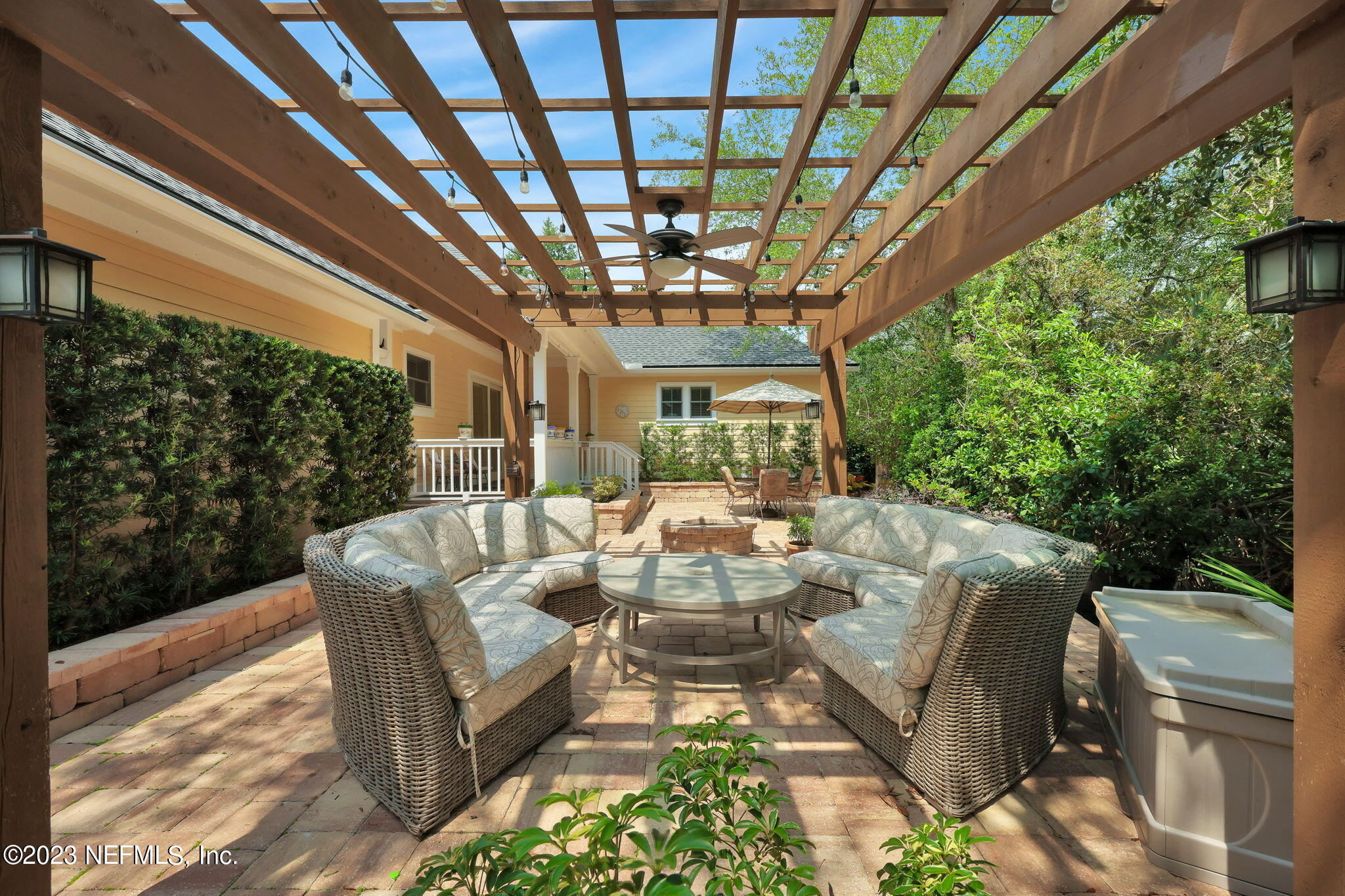120 Istoria Drive St. Augustine, FL 32095 - Photo 57 of 90 a view of a patio with couches table and chairs and potted plants