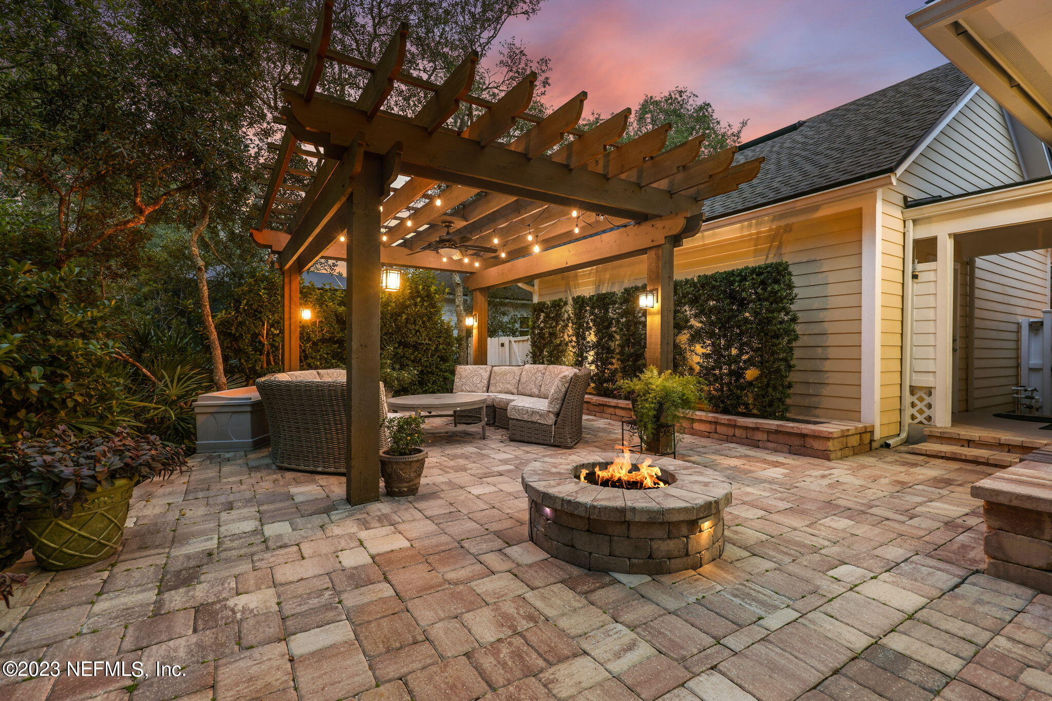 120 Istoria Drive St. Augustine, FL 32095 - Photo 62 of 90 a view of a patio with table and chairs and potted plants