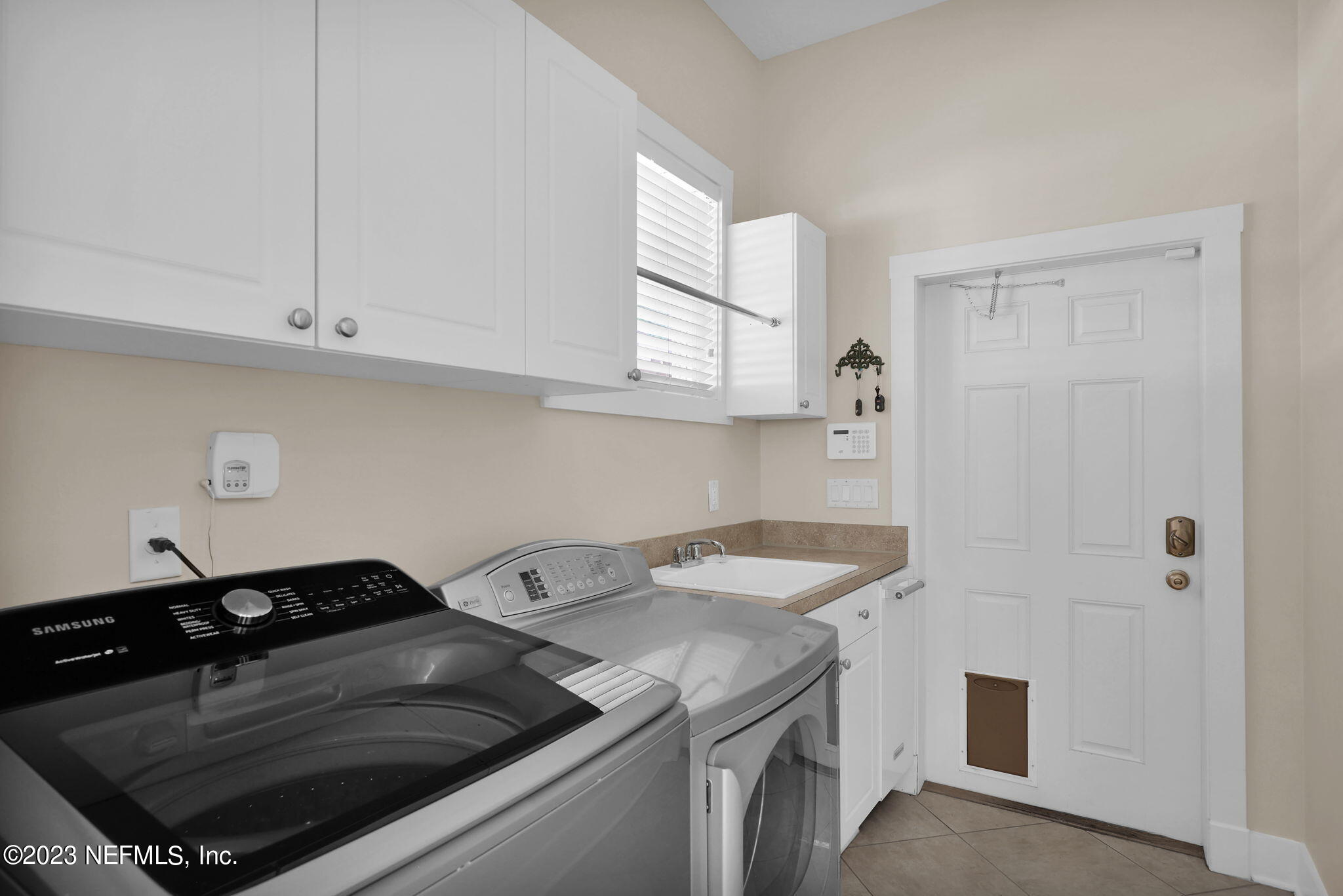 120 Istoria Drive St. Augustine, FL 32095 - Photo 64 of 90 a kitchen with a stove and a white cabinets