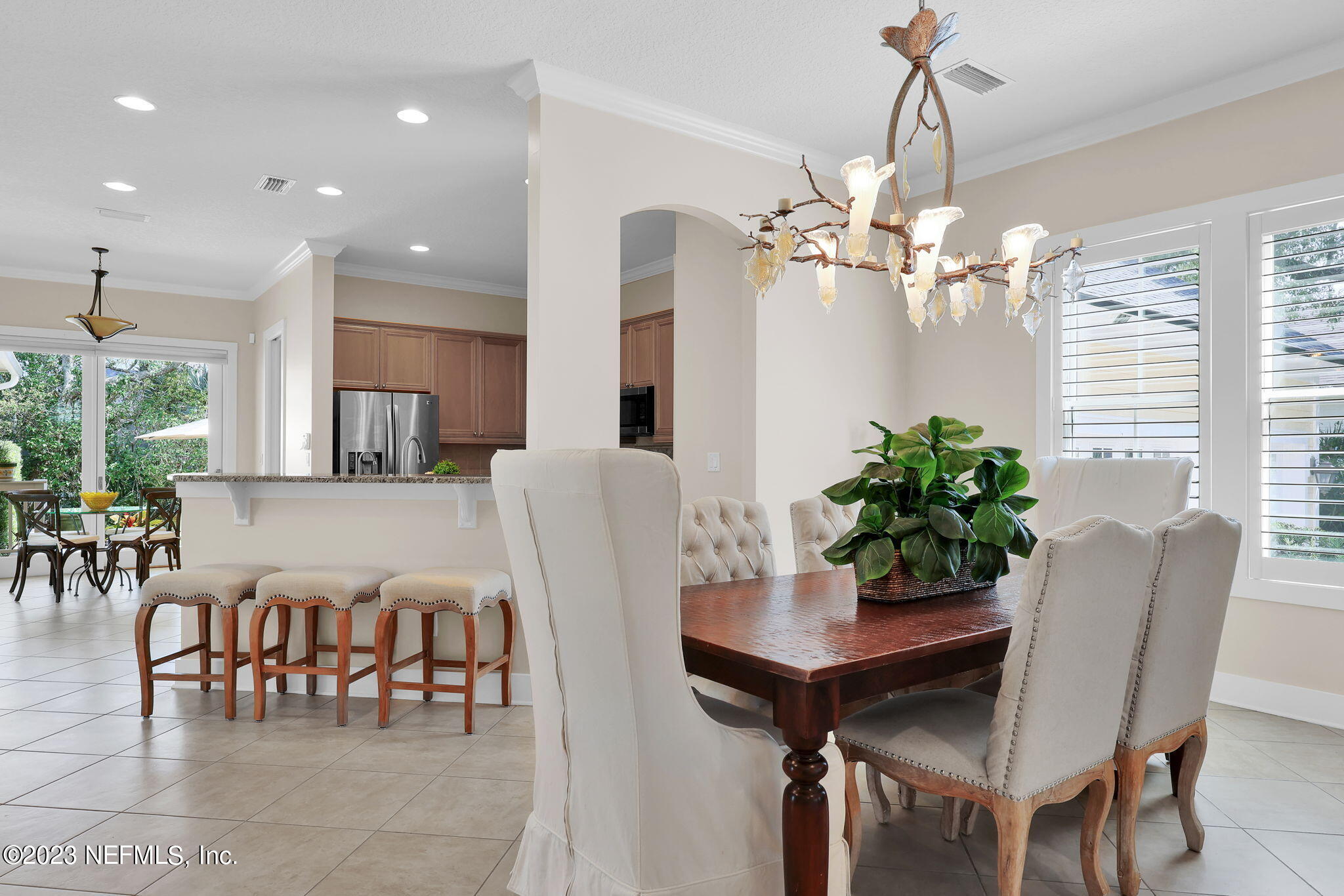120 Istoria Drive St. Augustine, FL 32095 - Photo 10 of 90 a view of a dining room with furniture and a chandelier