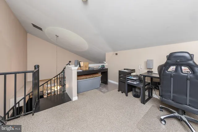 a view of a chairs and table in a room