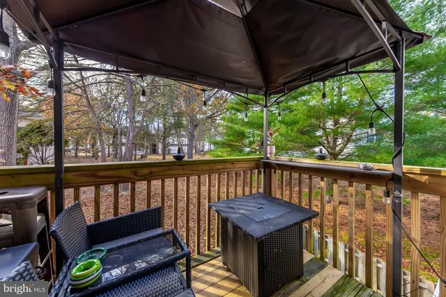 a view of a two chairs in the balcony
