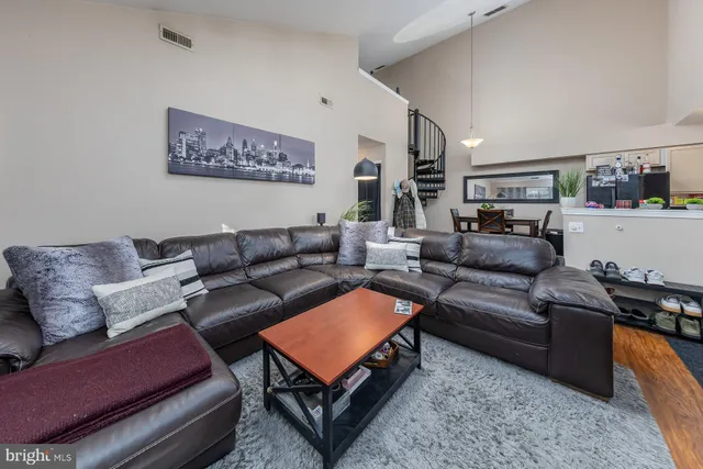 a living room with furniture and a couch