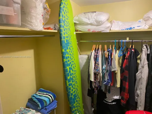 a bedroom with a bed and a lamp