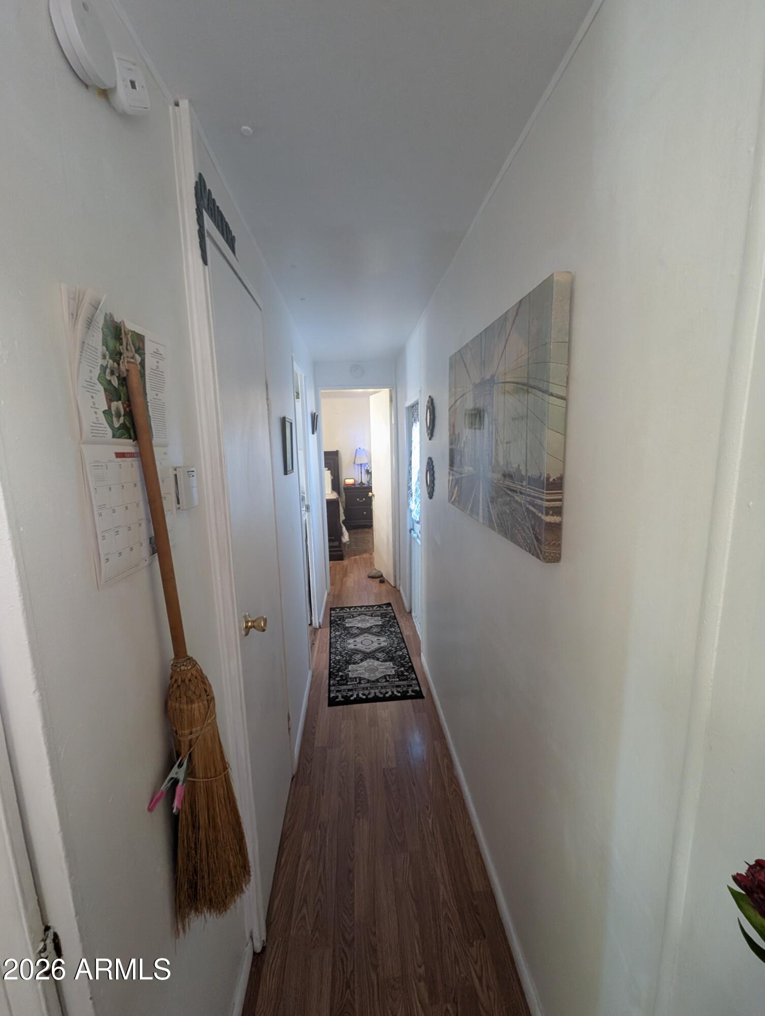 850 West Sieling Loop Bisbee, AZ 85603 - Photo 8 of 11 a view of a hallway with wooden floor and stairs