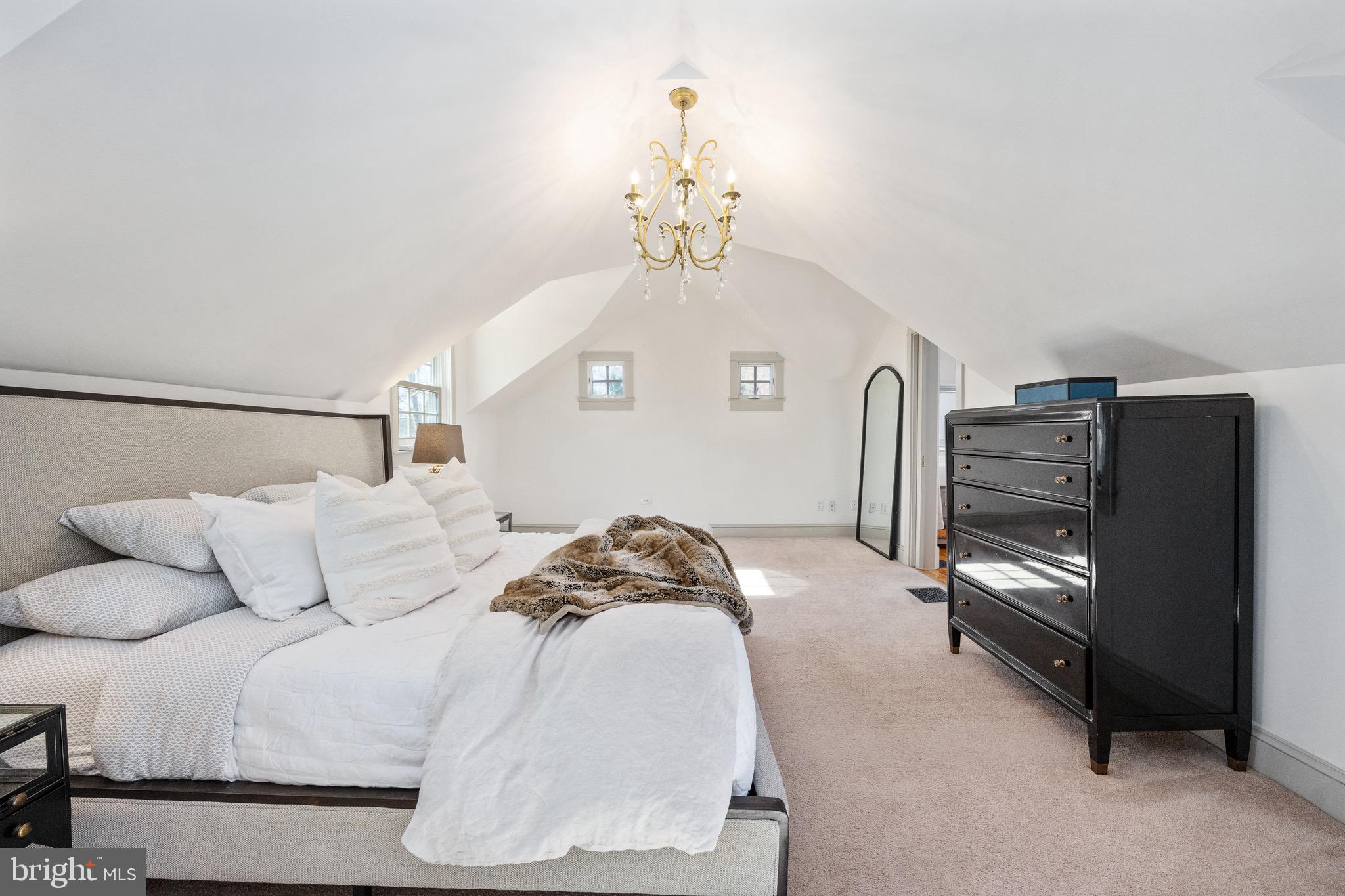 560 Richmond Road Amissville, VA 20106 - Photo 59 of 133 a bedroom with a bed and a chandelier