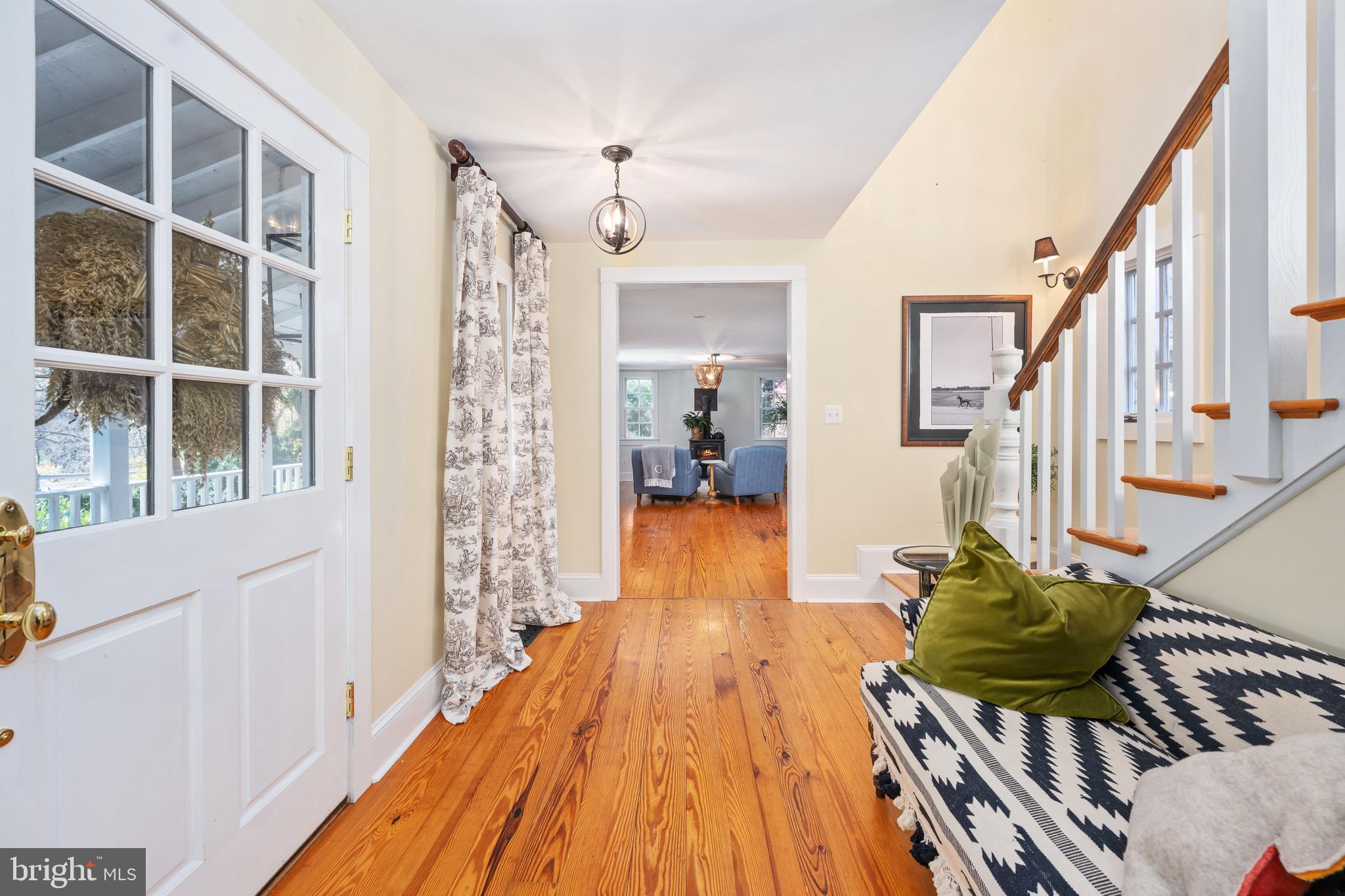 560 Richmond Road Amissville, VA 20106 - Photo 6 of 133 a view of a hallway with wooden floor and staircase