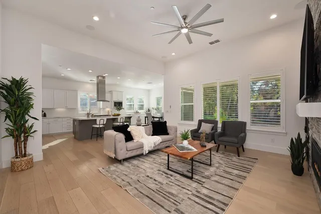 a large kitchen with a table and chairs in it