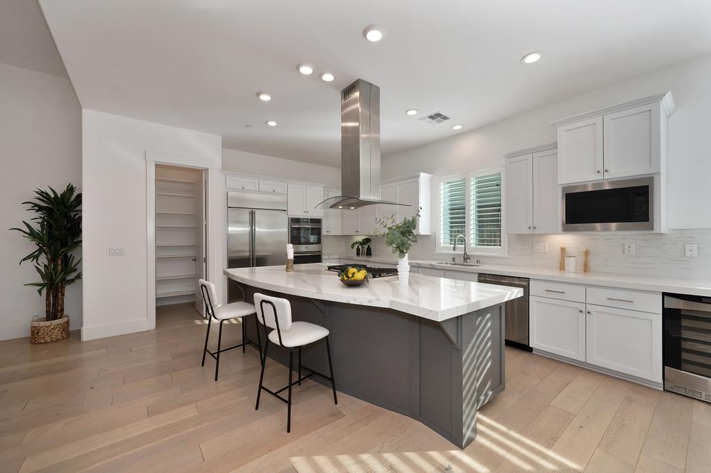 5855 Tree Swallow Circle Rocklin, CA 95677 - Photo 20 of 72 a kitchen with counter top space cabinets and appliances