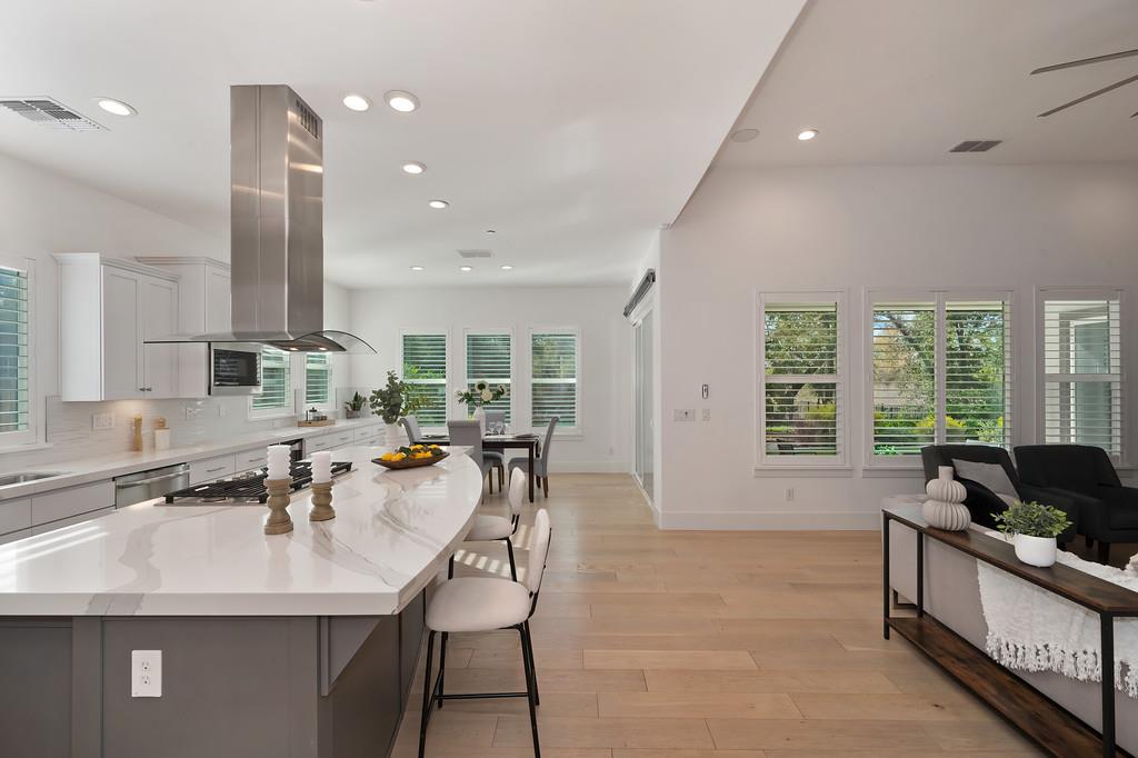 5855 Tree Swallow Circle Rocklin, CA 95677 - Photo 21 of 72 a kitchen with stainless steel appliances granite countertop a sink and a refrigerator