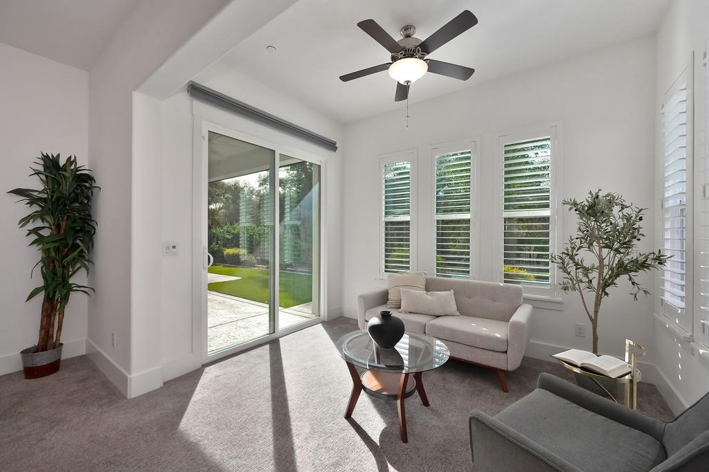 5855 Tree Swallow Circle Rocklin, CA 95677 - Photo 40 of 72 a living room with furniture and a large window