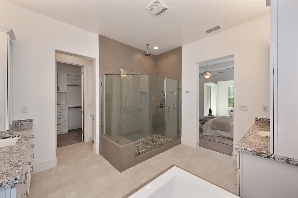 5855 Tree Swallow Circle Rocklin, CA 95677 - Photo 48 of 72 a bathroom with a tub and shower