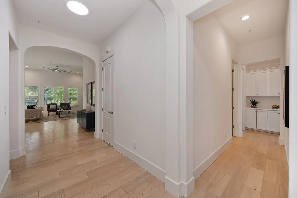 5855 Tree Swallow Circle Rocklin, CA 95677 - Photo 49 of 72 a view of a hallway view with wooden floor and a living room
