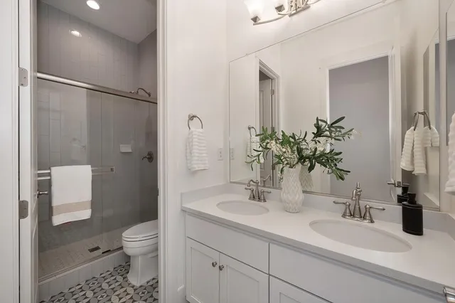 a view of a city with lush green forest