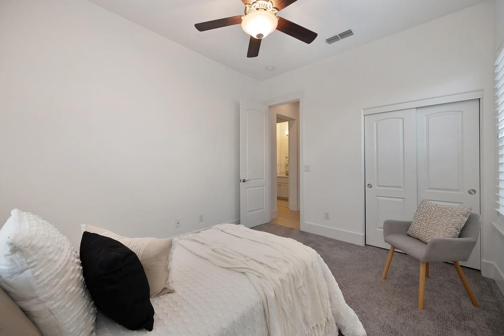 5855 Tree Swallow Circle Rocklin, CA 95677 - Photo 55 of 72 a bedroom with a bed and a chair