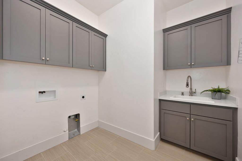 5855 Tree Swallow Circle Rocklin, CA 95677 - Photo 60 of 72 a view of a kitchen with cabinets