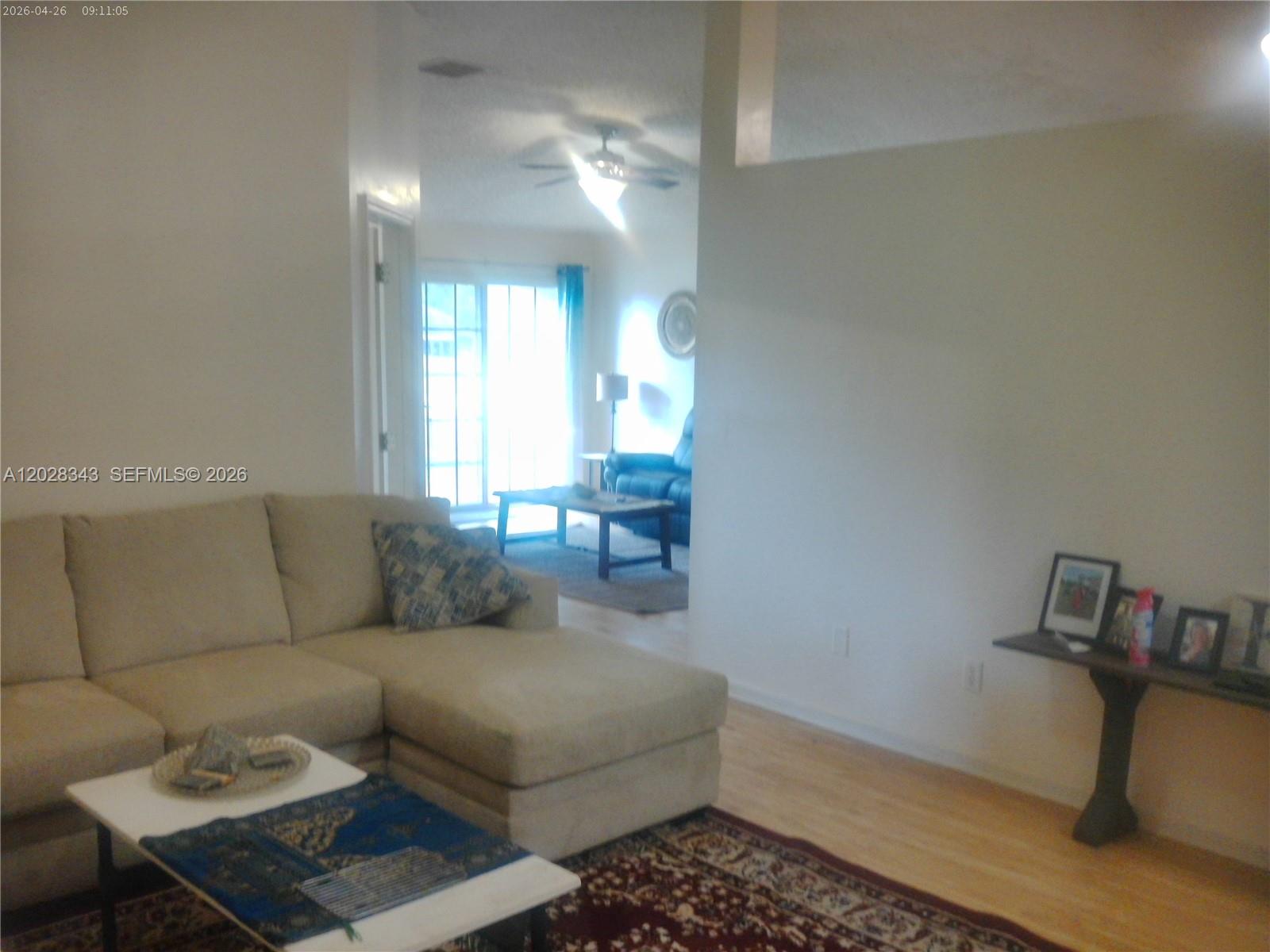 1641 Spring Oaks Lane Jacksonville, FL 32221 - Photo 19 of 44 a living room with furniture and a chandelier