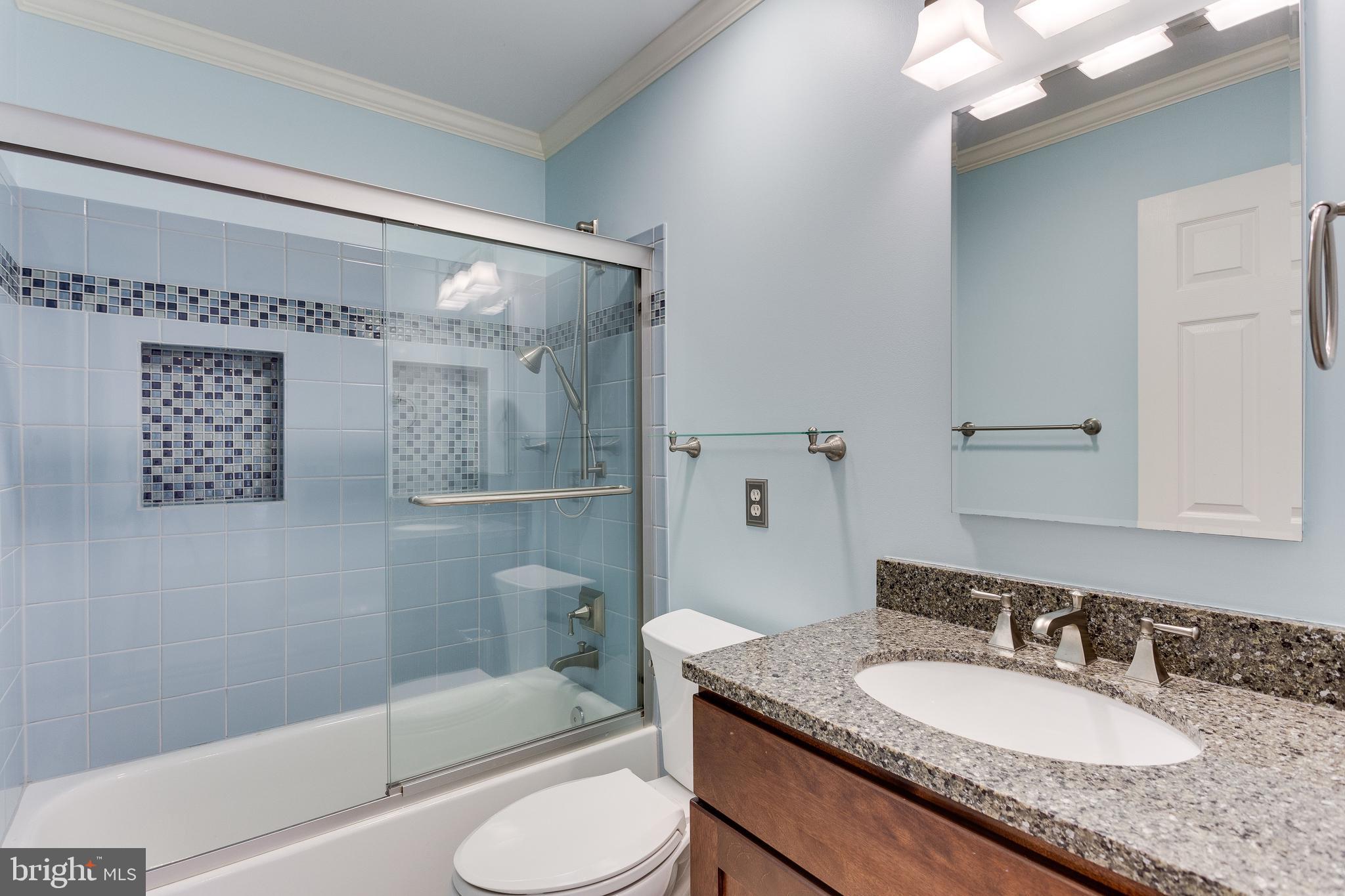8001 Folkstone Road Manassas, VA 20111 - Photo 22 of 40 Updated hall bath with glass tile details