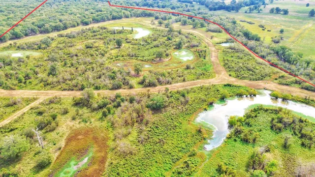 a view of a field with an outdoor space