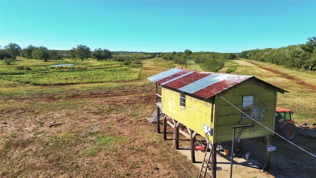 a aerial view of a house with a yard