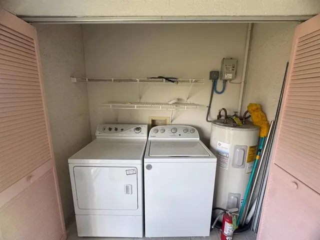 a utility room with dryer and washer