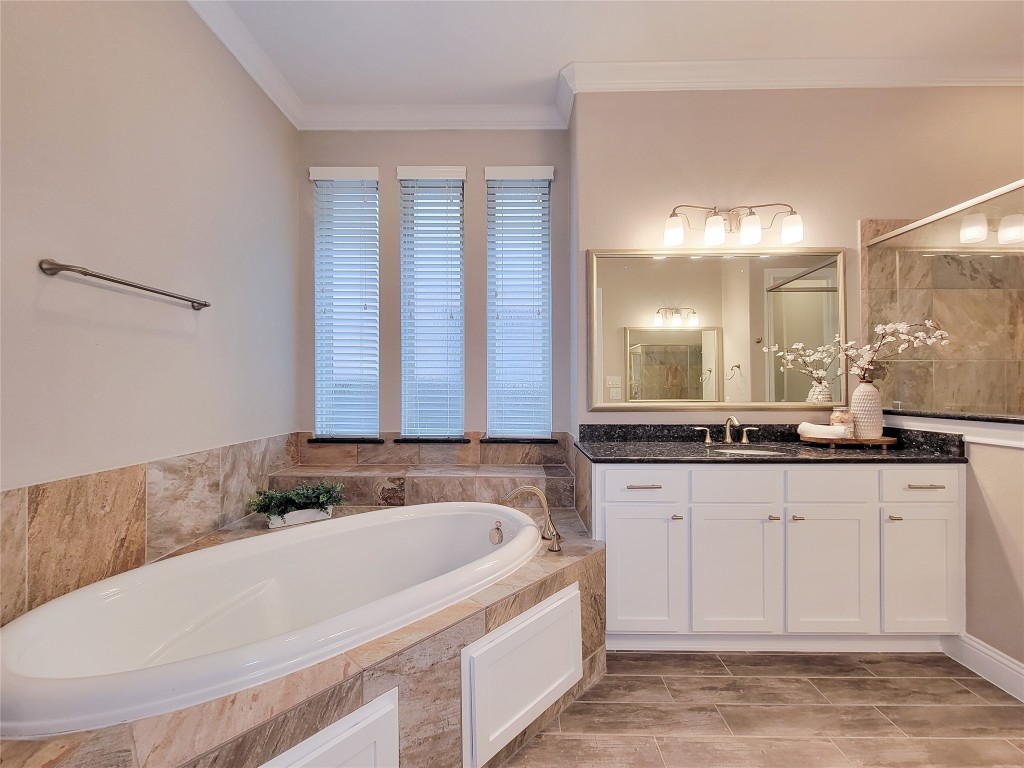 9706 Kirkstone Terrace Drive Spring, TX 77379 - Photo 25 of 46 primary bathroom with soaker tub and shower, double sinks