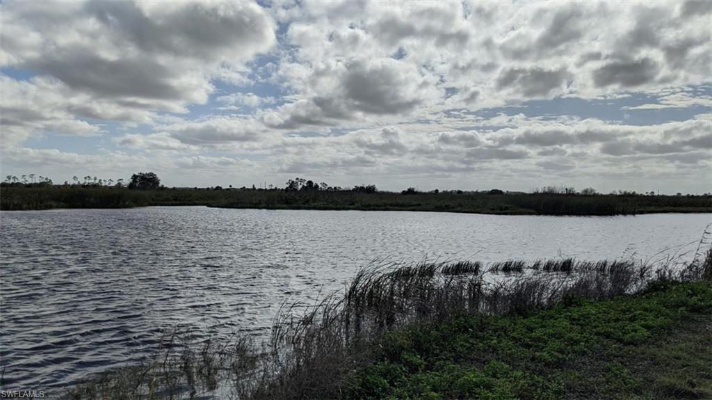 Xx Sears Road LaBelle, FL 33935 - Photo 1 of 4 a view of a lake from a yard