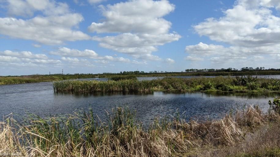 Xx Sears Road LaBelle, FL 33935 - Photo 3 of 4 a view of a lake with houses in the back