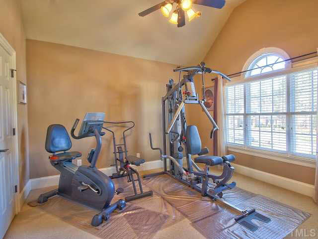 9705 Bailey Grove Court Raleigh, NC 27613 - Photo 16 of 25 Another second floor bedroom, this one has a vaulted ceiling, ceiling fan, palladium window and has a private bath.