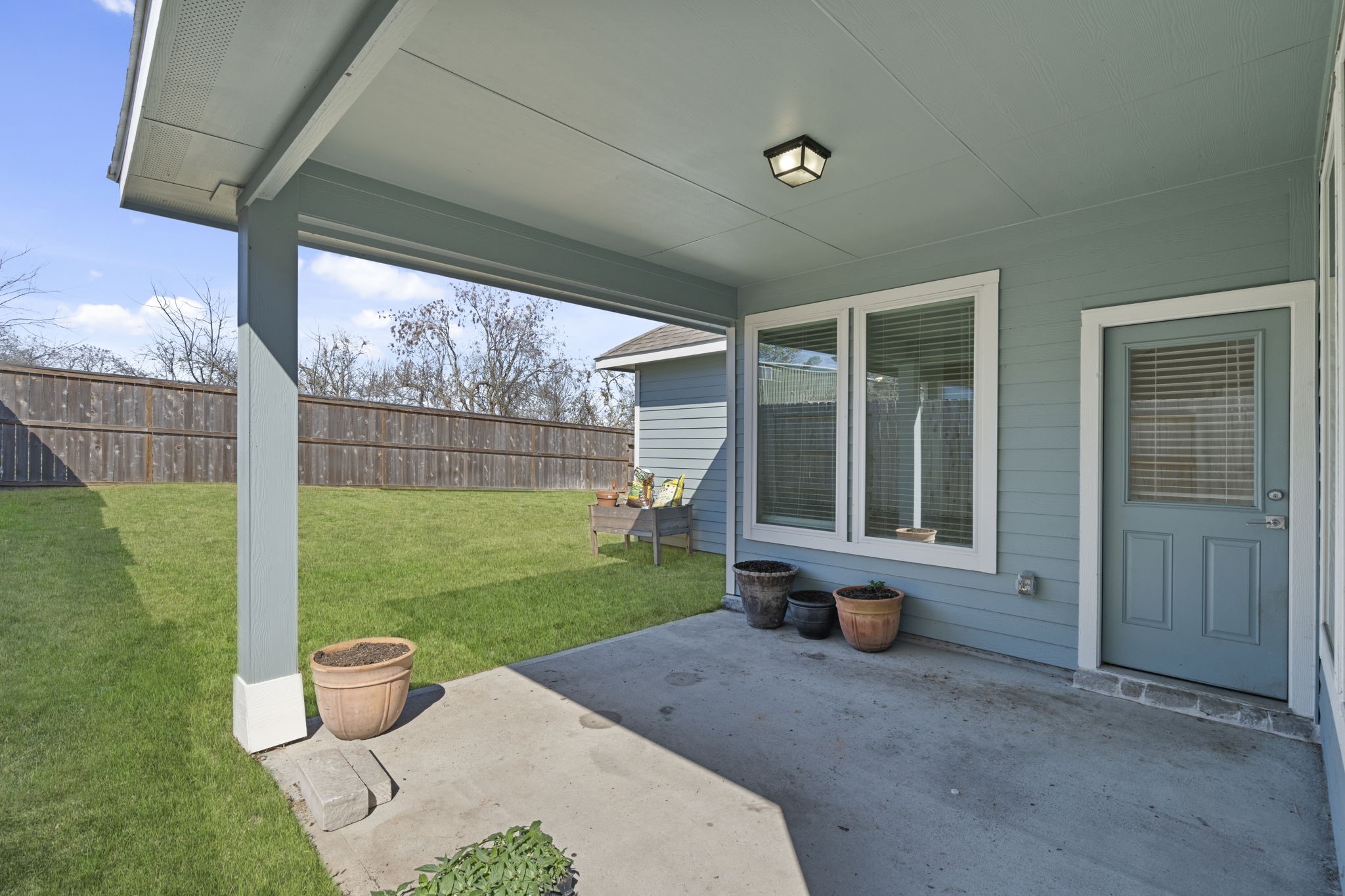 33130 School Hl Road Fulshear, TX 77441 - Photo 28 of 32 Another angels of covered rear patio