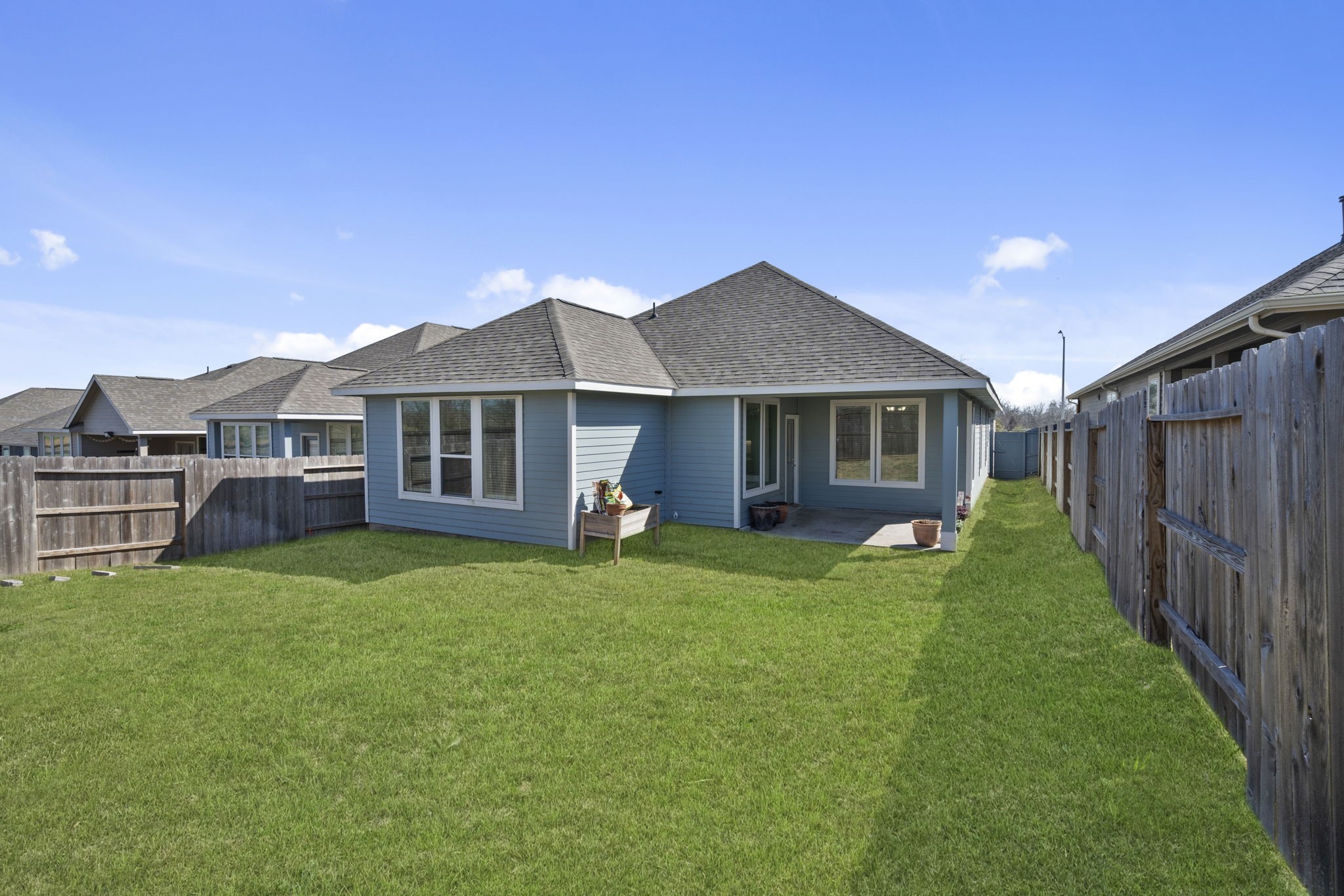 33130 School Hl Road Fulshear, TX 77441 - Photo 29 of 32 Rear yard looking towards the home and covered rear patio