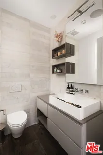 a kitchen with a sink cabinets and utility