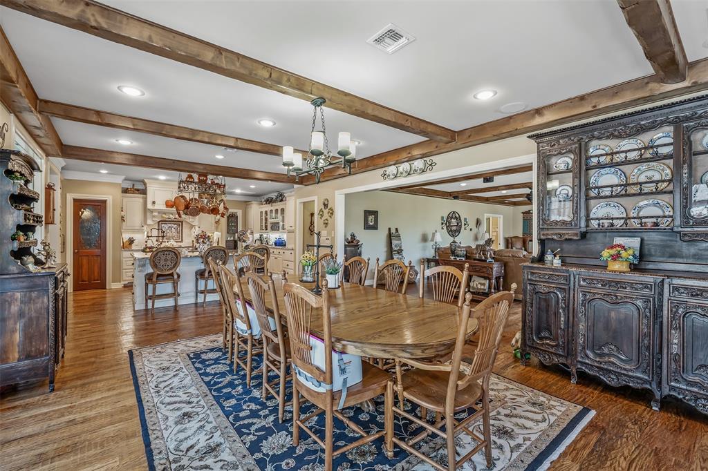 535 Riata Road Bullard, TX 75757 - Photo 11 of 40 a view of a dining room with furniture wooden floor and chandelier