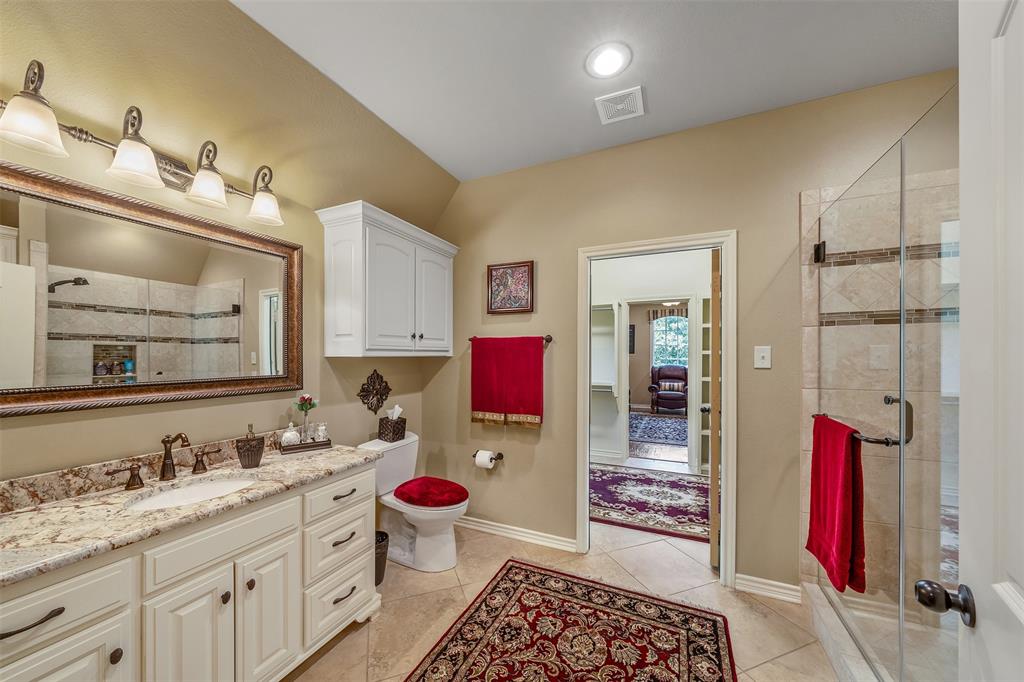 535 Riata Road Bullard, TX 75757 - Photo 21 of 40 a bathroom with a sink and a mirror