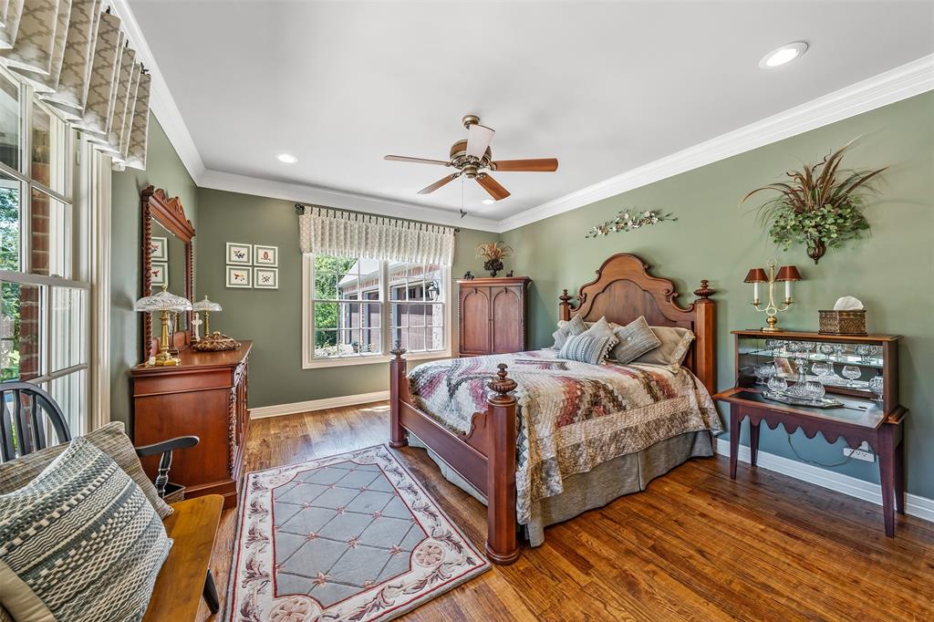 535 Riata Road Bullard, TX 75757 - Photo 24 of 40 a bedroom with a bed and wooden floor