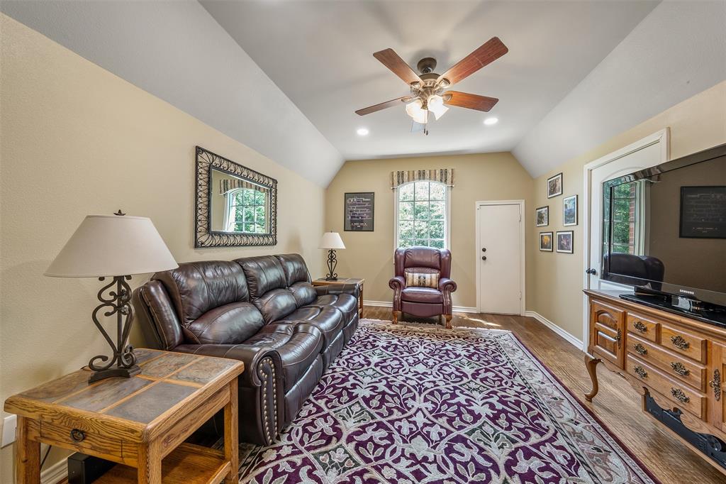 535 Riata Road Bullard, TX 75757 - Photo 26 of 40 a living room with furniture and a flat screen tv