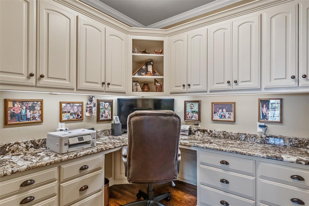535 Riata Road Bullard, TX 75757 - Photo 31 of 40 a kitchen with granite countertop white cabinets and sink