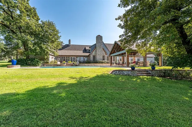 a view of a house with a big yard