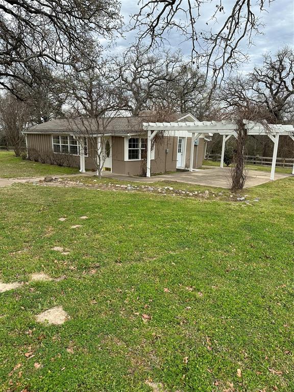 535 Riata Road Bullard, TX 75757 - Photo 35 of 40 a front view of a house with a garden