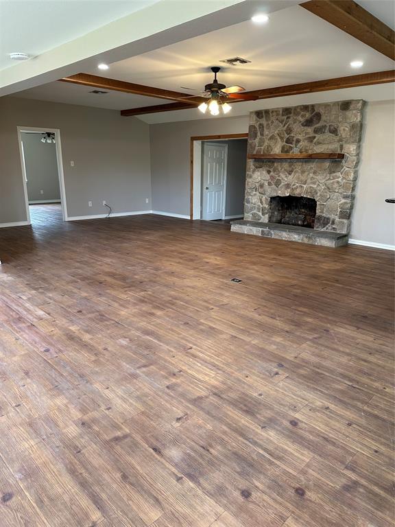 535 Riata Road Bullard, TX 75757 - Photo 37 of 40 an empty room with wooden floor and fireplace