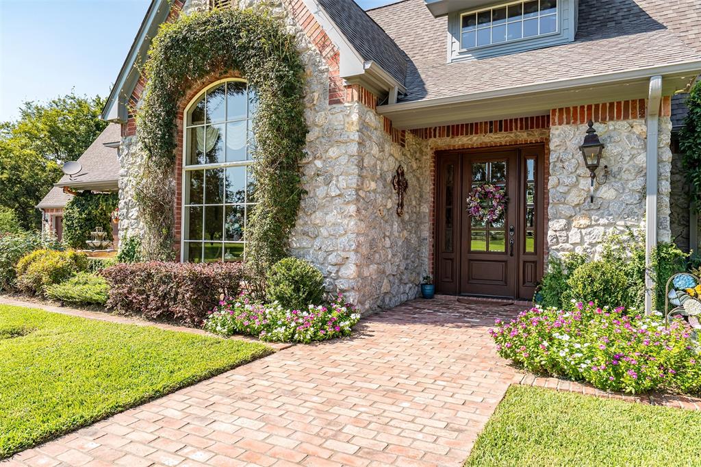 535 Riata Road Bullard, TX 75757 - Photo 5 of 40 a front view of a house with garden