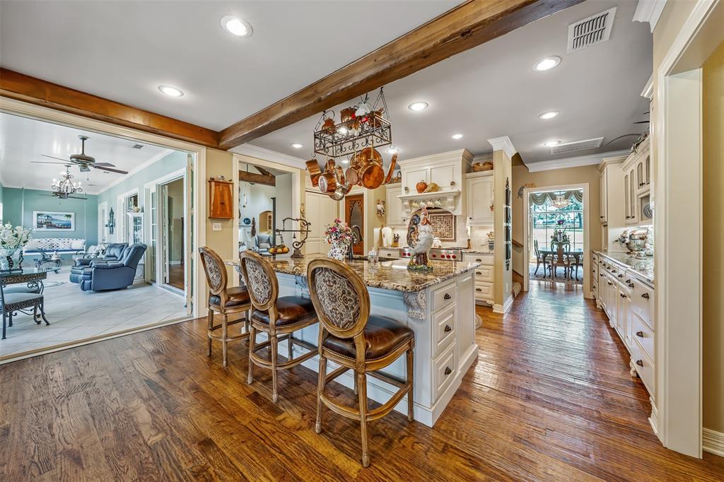 535 Riata Road Bullard, TX 75757 - Photo 9 of 40 a view of a dining room with furniture and wooden floor