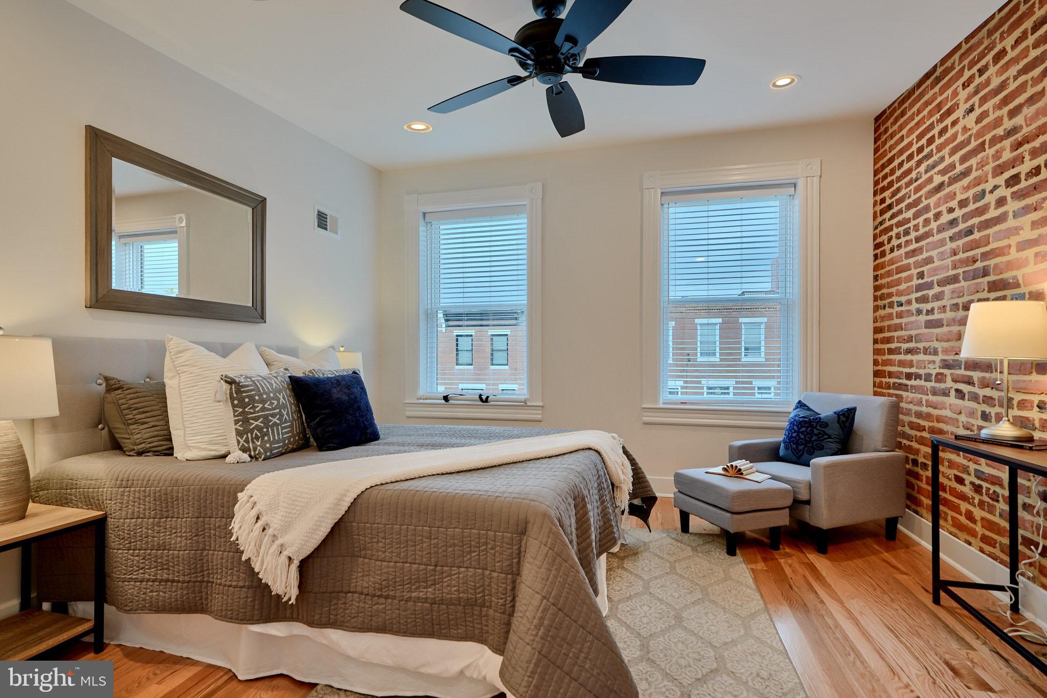 1427 Patapsco Street Baltimore, MD 21230 - Photo 11 of 20 a bedroom with a bed and a couch