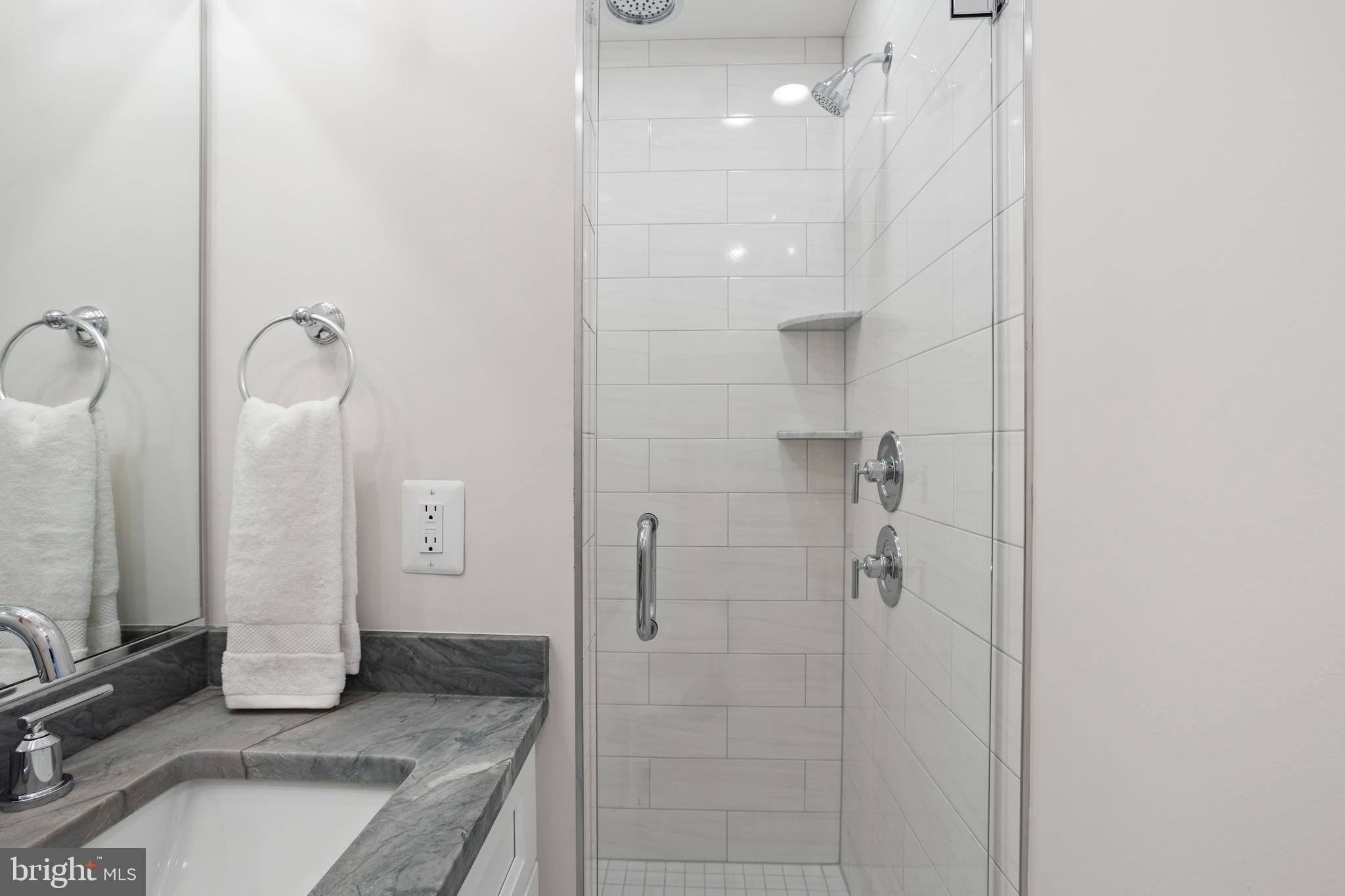 1427 Patapsco Street Baltimore, MD 21230 - Photo 13 of 20 a bathroom with a granite countertop shower