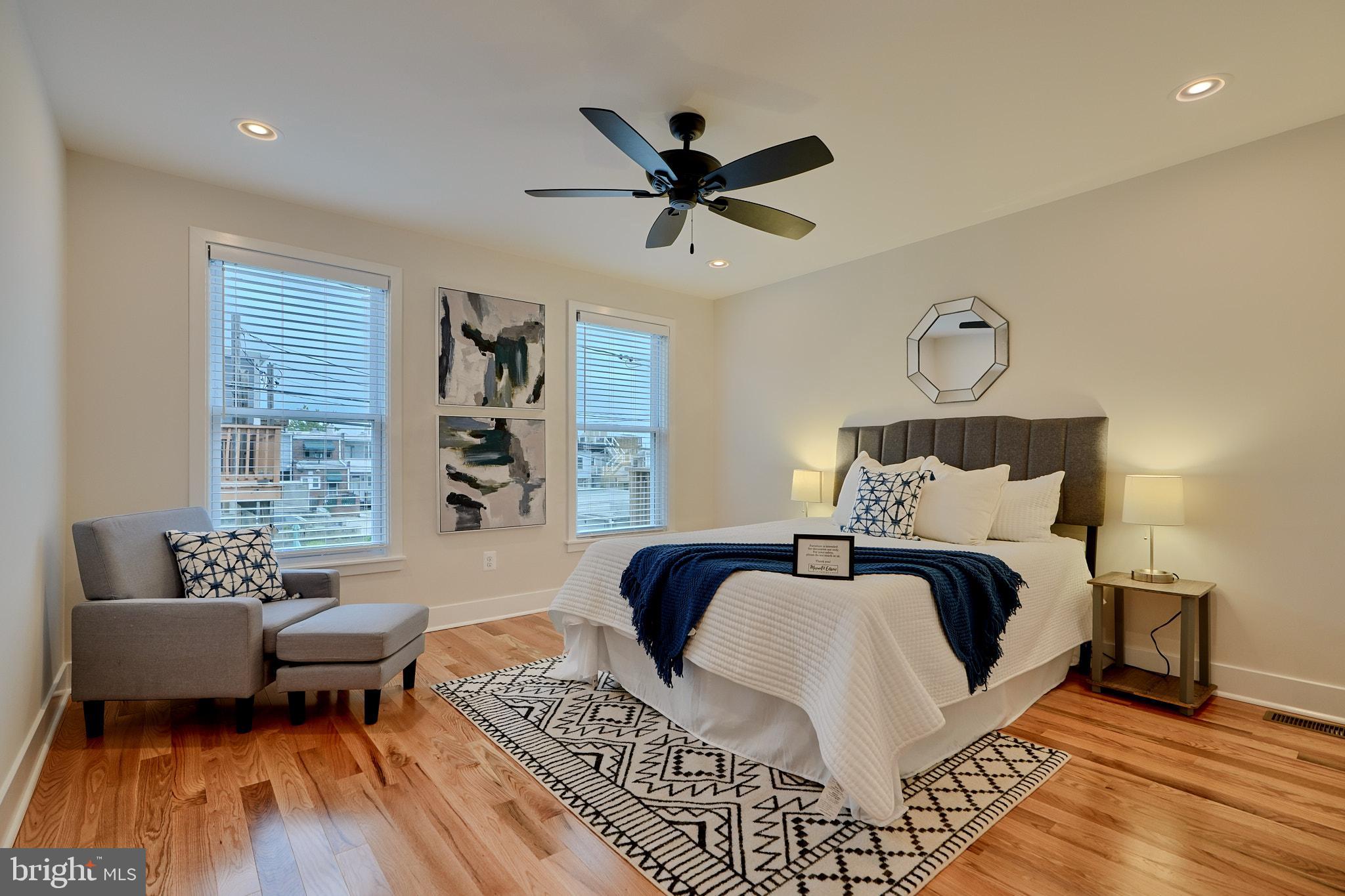 1427 Patapsco Street Baltimore, MD 21230 - Photo 15 of 20 a bed room with a bed and a couch