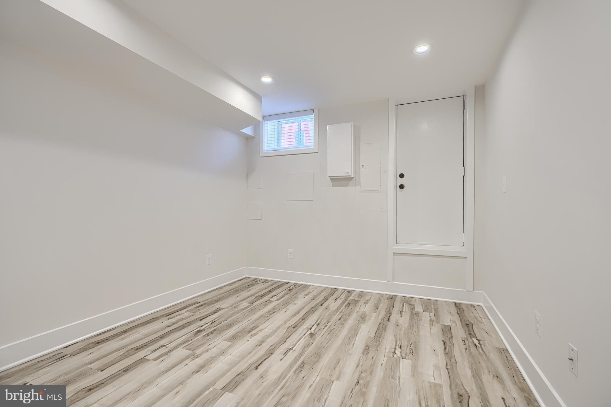 1427 Patapsco Street Baltimore, MD 21230 - Photo 15 of 34 a view of room with window and hardwood floor